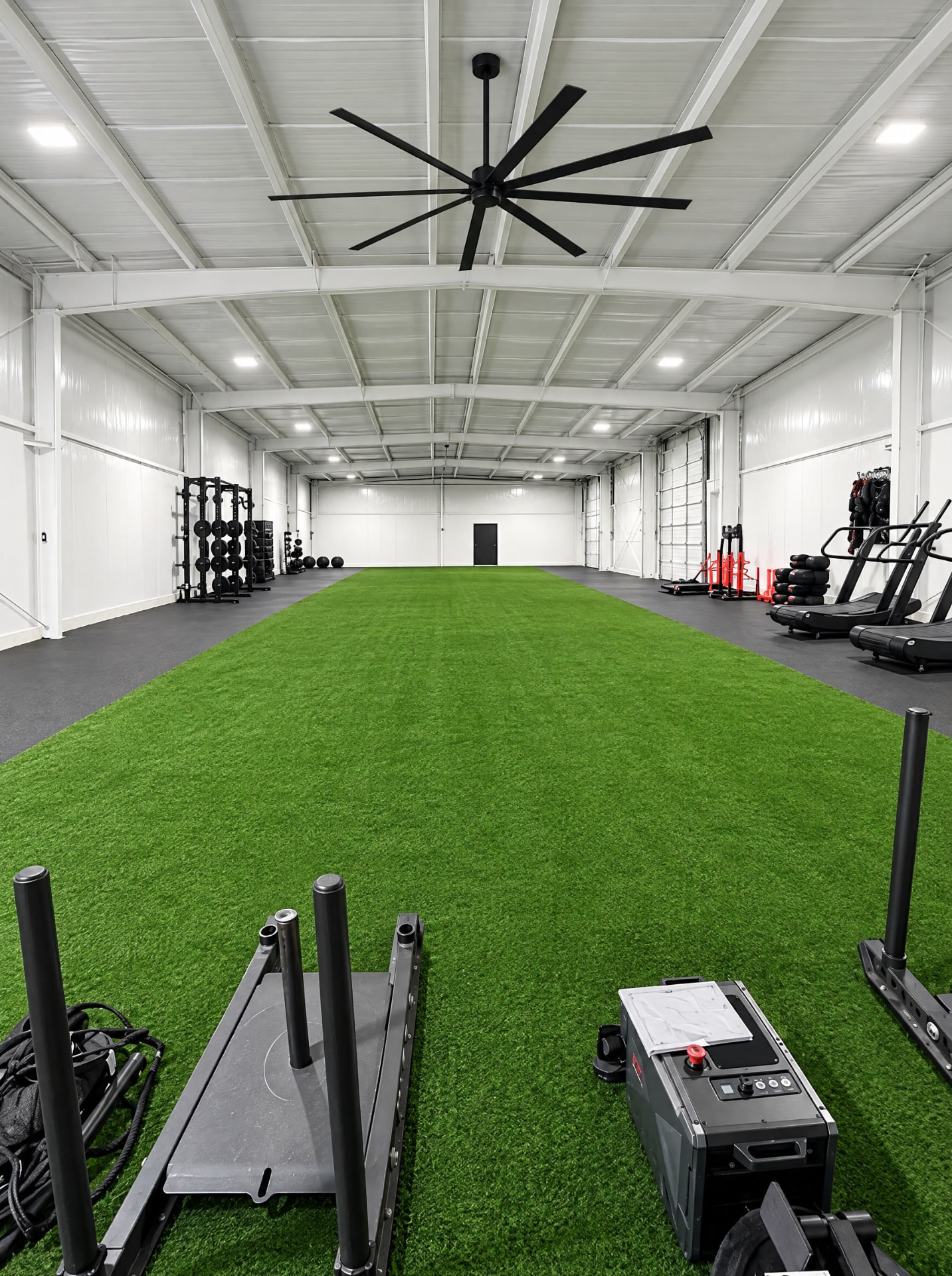 Training sleds facing THE R's full-length indoor turf lane